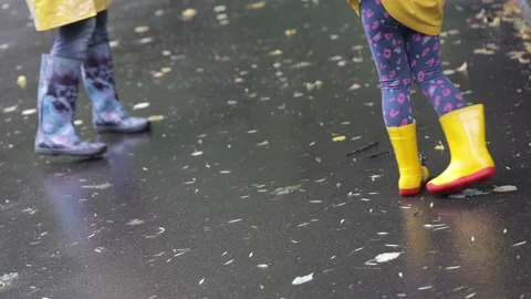 Walk in the rain in rubber boots Stock Footage 157688801