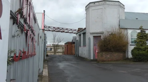 Walk into scruffy old small light industrial estate, 動画素材 1104061