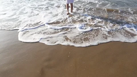 Walk on the sea waves Stock Footage 153998521