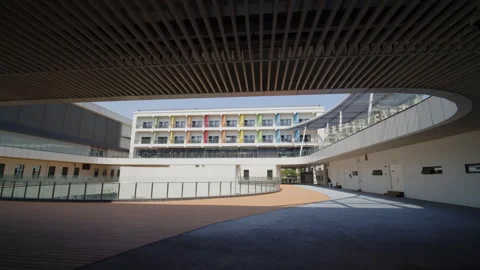 Walk from the shadowed corridors to the bright central sunken plaza 動画素材 274209335