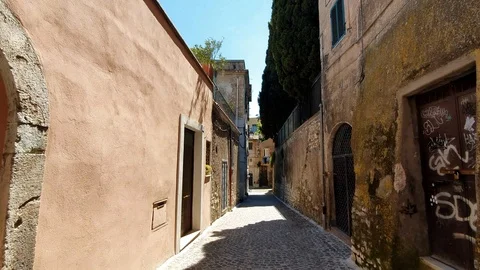 Walk the small old, deserted streets of Italy. Tourist walk on a Sunny day Stock Footage 112670373