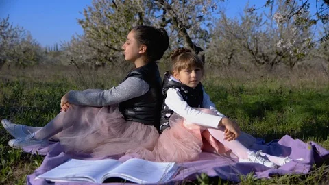 Walk in the spring garden of two sisters Stock Footage 102682106