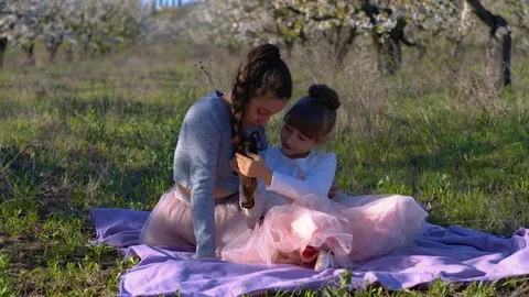 Walk in the spring garden of two sisters Stock Footage 102682191