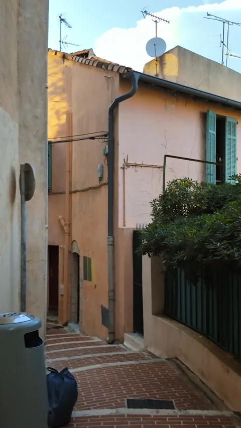 A walk on the street, down the stairs, between buildings in Cannes, France. Stock Footage 309717893