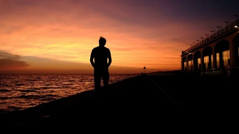Walk at sunset alongside Molo dei Bersaglieri in Trieste Stock Footage 81735143
