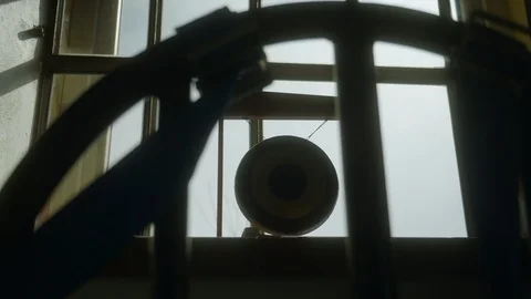 Walk through the bars to a small illuminated gong at the window Video stock 127497668