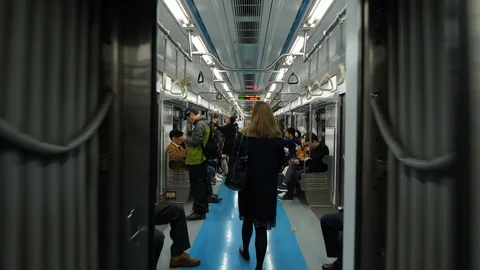 Walk through metro car, train depart from station Stock Footage 123486604