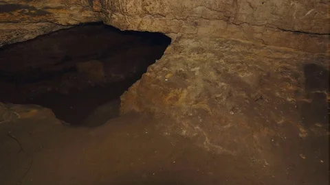 Walk through underground tunnel built in soft sandstone rock. Underground shelte Stock Footage 88469038