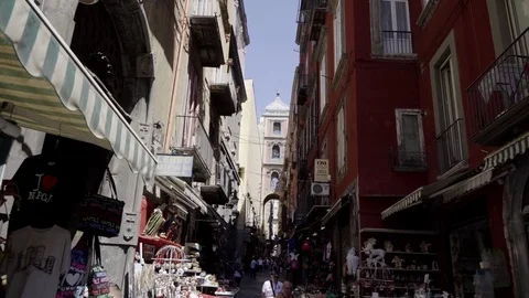 A walk in a typical street of Naples, between the old buildings and the shops Stock Footage 83545408