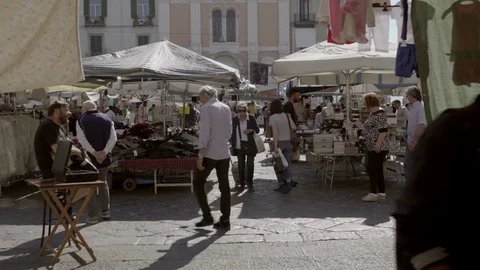 A walk in a typical street of Naples, between the old buildings and the traditio Stock Footage 83546037