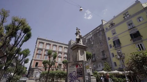 A walk in a typical street of Naples, in a square with a statue. Stock Footage 83546232