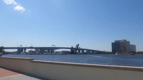 Walk with view of downtown river bridge Stockbeeldmateriaal 155753132