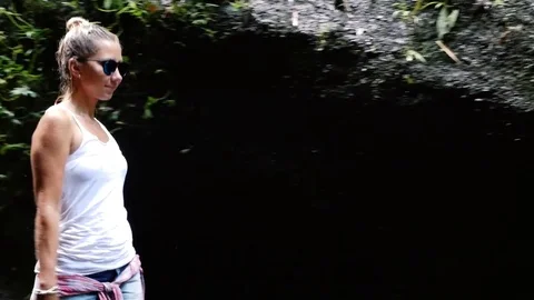 Walk to the waterfall along the path in the rainforest. Bali, Stock Footage 73757409