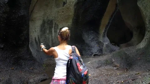 Walk to the waterfall along the path in the rainforest. Bali, Indonesia. Stock Footage 84786912