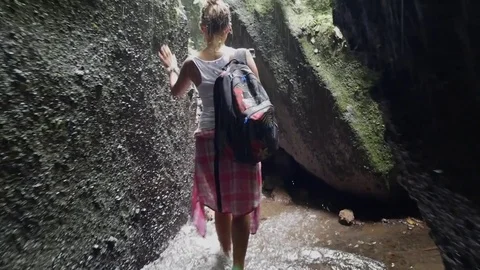 Walk to the waterfall along the path in the rainforest. Bali, Indonesia. Stock Footage 84787028