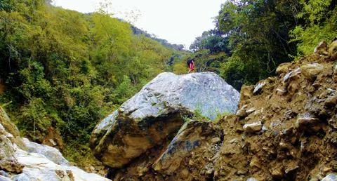 Walker on giant rock Stock Photos