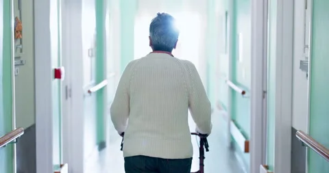 Walker, healthcare and back of old woman in hospital for rehabilitation, checkup 스톡 동영상 340899337