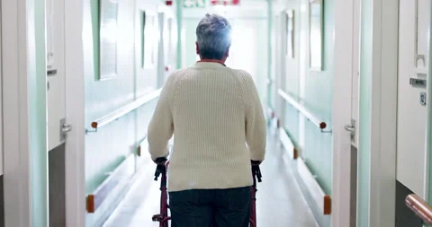 Walker, medical and back of old woman in hospital for rehabilitation, checkup or 스톡 동영상 340880860