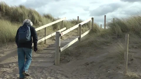 Walker senior citizen coast path Stock Footage 47072216