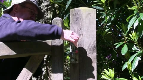 A walker using a gate on the Brown Clee Video stock 11275445