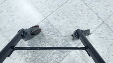 Walker with wheels moves across smooth floor in indoor environment Vídeos de archivo 344752090