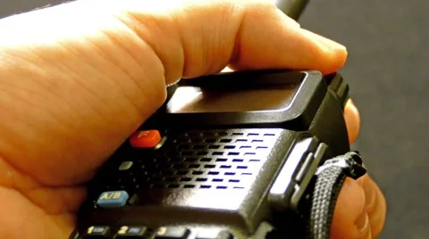 Walkie talkie in hand.  On, off and settings Stock Footage 45366569