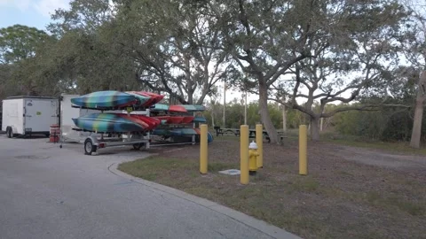 Walkin in POV of Multiple colored red, blue,orange and green Kyacks Stock Footage 260644568