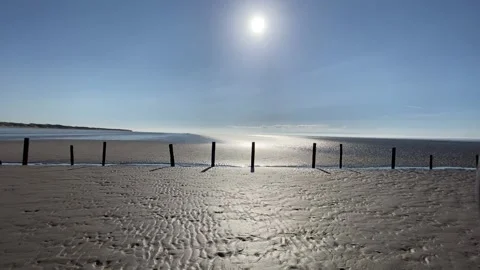 Walking across the beach with the Sunsetting Video stock 149685351