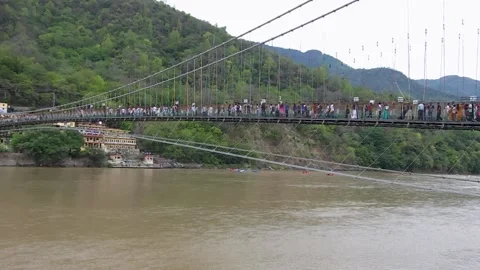 Walking Across Rishikesh’s Legendary Bridge Stock Footage 313564341