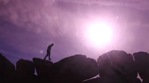 Walking across rocks silhouette 2 動画素材 47878097