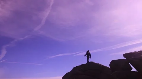 Walking across rocks silhouette Stock Footage 47878064