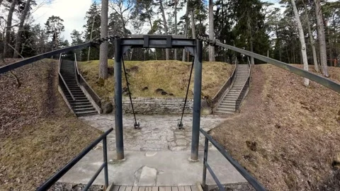 Walking across a suspension bridge in a forest park, stabilized POV Stock Footage 337556959