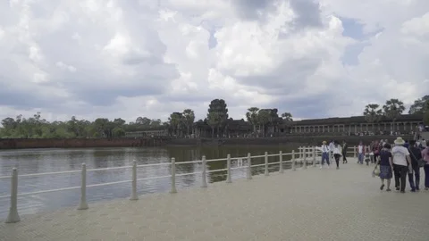 Walking across the temporary floating causeway across the moat surrounding Stock Footage 108709986