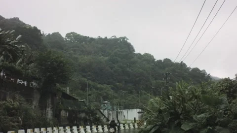 Walking action movement view of paved street with hill mountain tropical vegetat Video stock 236239845