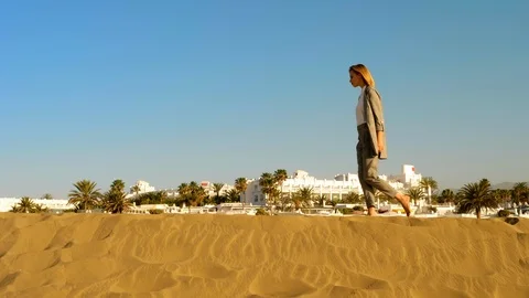 Walking alone in the sand dunes Stock Footage 106191111