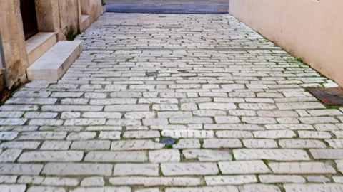Walking along an ancient stone pavement Stock Footage 133128022
