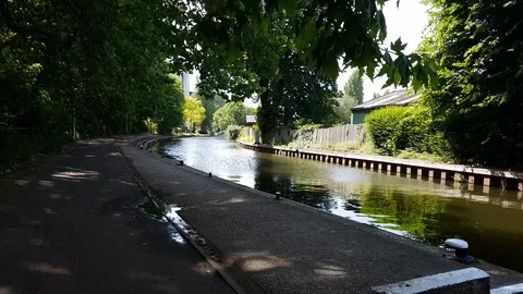 Walking along the bank of the river Thames on a sunny day, 4K Stock Footage 111491512