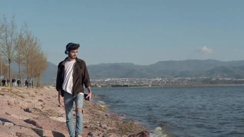 Walking along beach Stock Footage 154138554