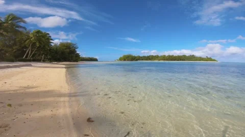 Walking along beach sandy side look out to calm relax turquoise ocean lagoon ato Stock Footage 253461586