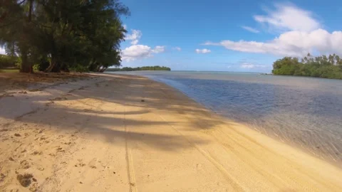Walking along beach sandy side look out to calm relax turquoise ocean lagoon wit Stock Footage 253462936
