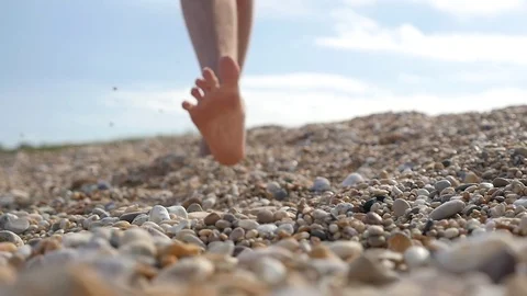 Walking along beach, slow motion Stock Footage 77436151