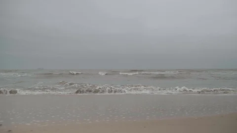 Walking along the beach with view on the ocean and the waves Stock Footage 100106127
