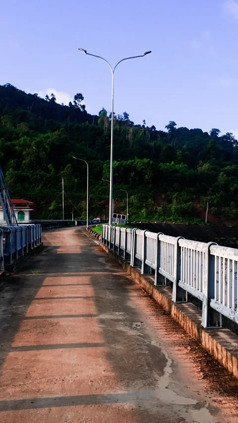 Walking along the bridge at Da Lay Irrigation Reservoir in Lam Dong Vietnam Vidéo 348721949