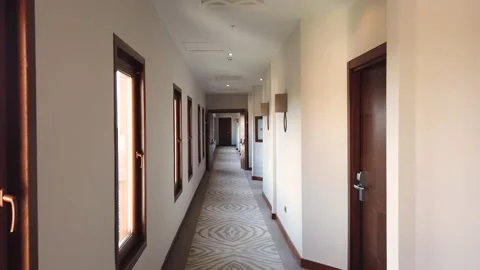 Walking along the corridor of a hotel or business center. Long corridor with  Stock Footage 169745000