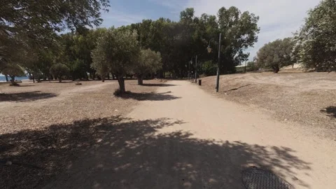 Walking along the Costa Blanca pathway near the beach in Benidorm Stock Footage 346017650