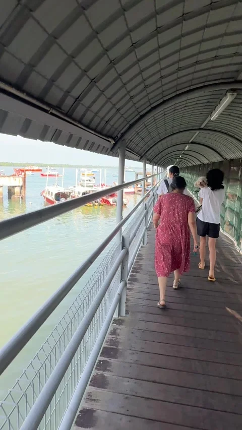 Walking Along Covered Jetty Bridge Towards Ferry Dock in Malaysia Stock Footage 340485533