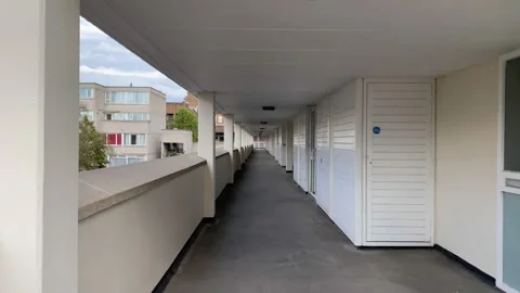 Walking along a covered walkway Stock Footage 180954896