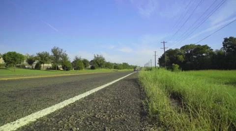 Walking along a highway in Texas Stock Footage 68503069