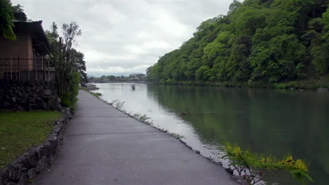 Walking Along the Hozu River Path in Arashiyama - Kyoto, Japan Stock Footage 336829078
