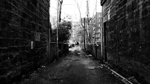 Walking along a narrow access road between old buildings 動画素材 171800535